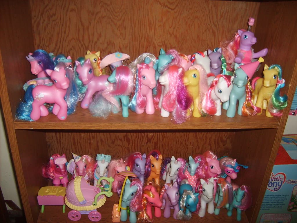 My Little Pony character Twilight Sparkle depicted on a premium trading card, with a collectible figure beside it.