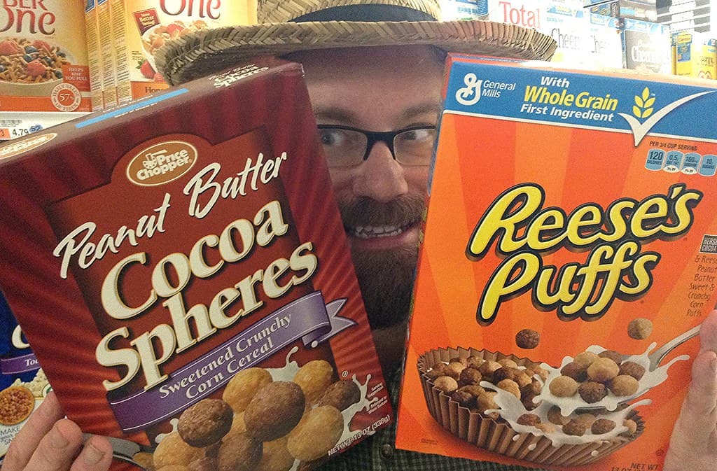 Key visual for the Reese's Puffs and GloRilla collaboration, showing the rapper and a custom cereal box