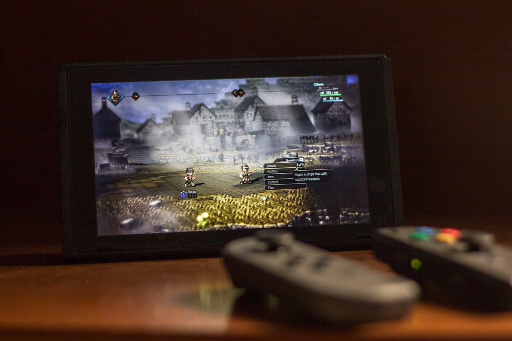 Key art showing the eight main characters from Octopath Traveler II standing together against a stylized backdrop.